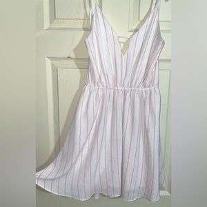 White dress with pink stripes and a tie-up back